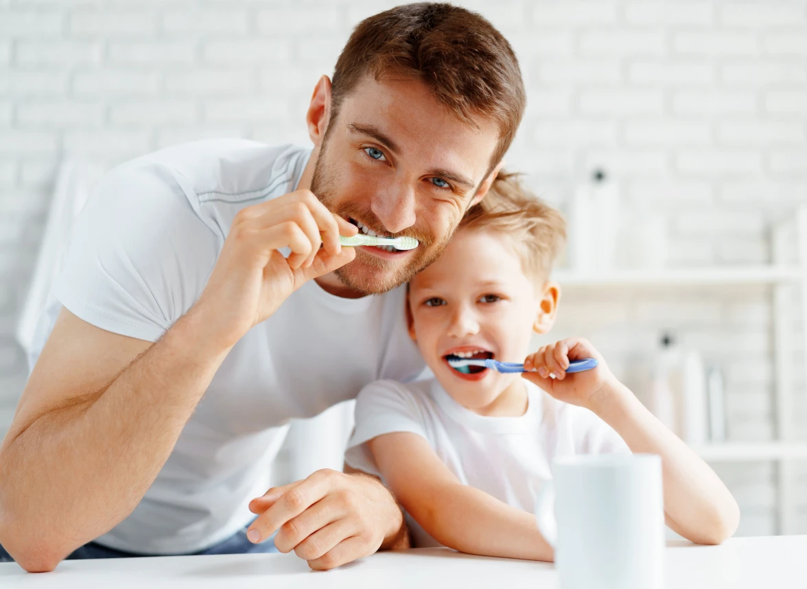 Father and Son Brushing Their Teeth