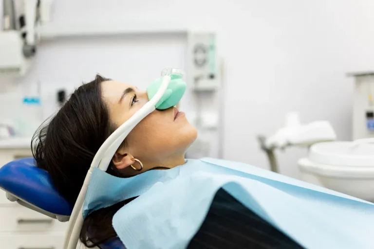 patient lying in a dental chair with sedation